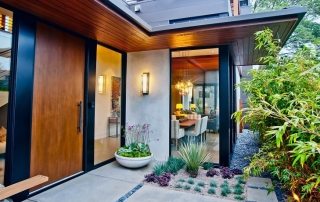Photo of entrance doors to a private house from various materials