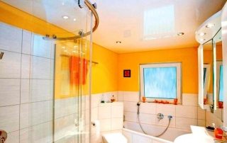Pros and cons of stretch ceilings in the bathroom: photos and useful tips