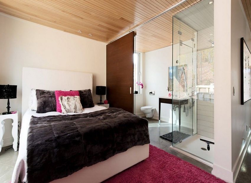 Combined partition on the border of the bathroom and bedroom made of glass and wood Combined partition on the border of the bathroom and bedroom made of glass and wood