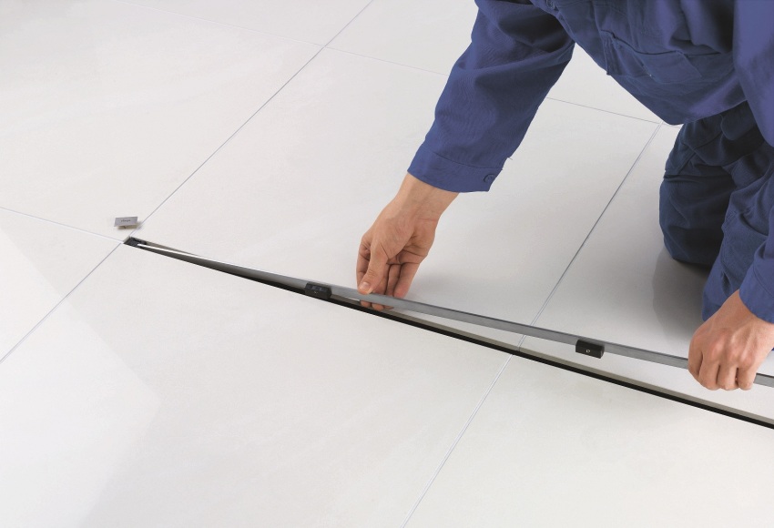 Step 4: laying tiles, installing a decorative grate for the drain Step 4: laying tiles, installing a decorative grate for the drain