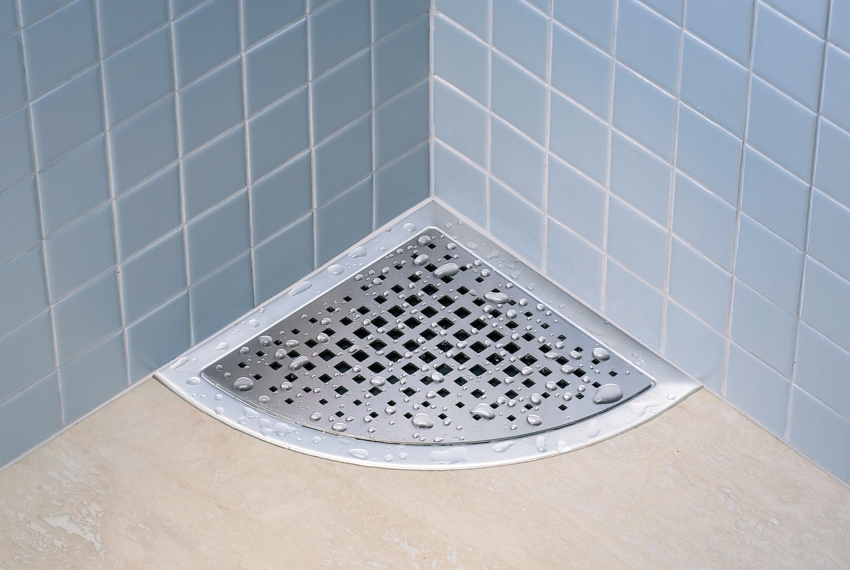 Corner drain in the floor of the shower Corner drain in the floor of the shower