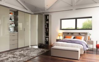 Corner wardrobe in the bedroom: a spacious and multifunctional element of the room