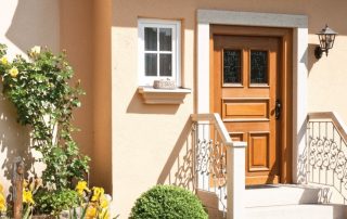 Wooden entrance door for a private house and apartment: reliability and design