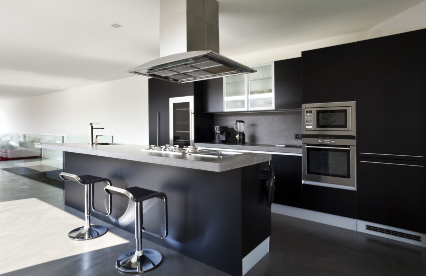 High-tech kitchen interior includes furniture with both glossy and matte facades. High-tech kitchen interior includes furniture with both glossy and matte facades.