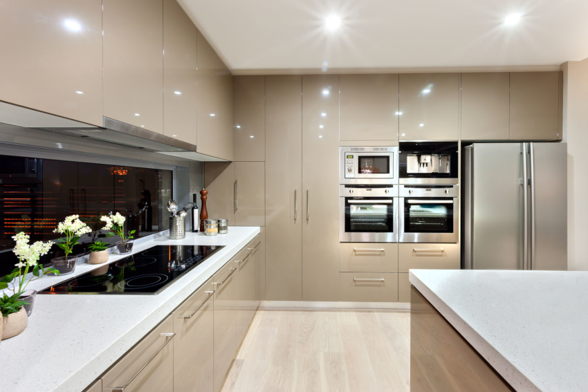 Beige color visually enhances the space of a small high-tech kitchen Beige color visually enhances the space of a small high-tech kitchen