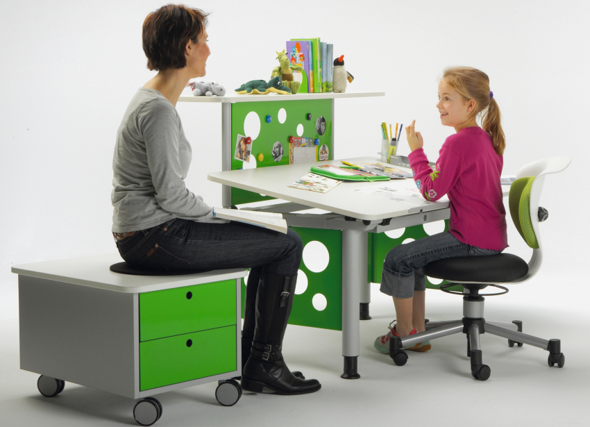 A chair that ensures the correct position of the child's body, helps him to work more effectively on homework A chair that ensures the correct position of the child's body, helps him to work more effectively on homework