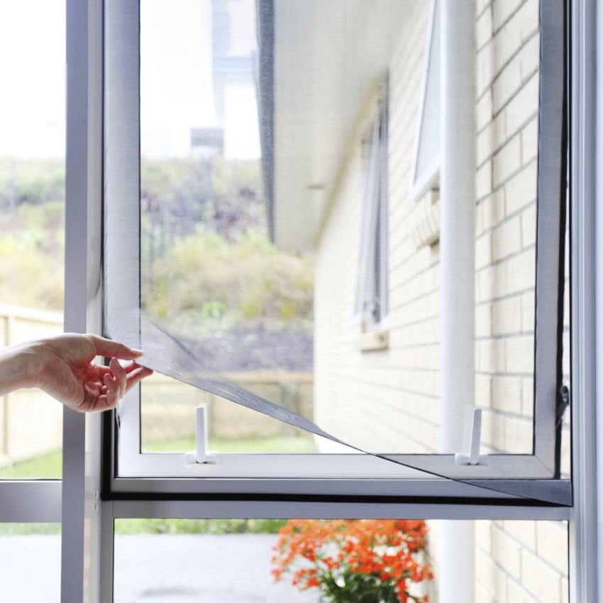 Thanks to the gray color, the fiberglass mesh remains almost invisible in the window opening Thanks to the gray color, the fiberglass mesh remains almost invisible in the window opening